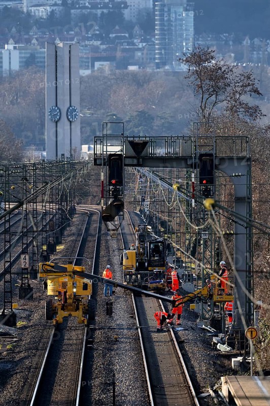 Labourers working with Liebherr A922 Rail Litronic and Kuhnle RR14 EVO 3 Rail two-way working platform on rails, line closure, construction site implementation of digital node between Waiblingen and Bad Cannstatt, Evangelische Stephanuskirche, Stuttgart, Baden-Württemberg, Germany