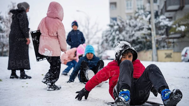 In Gaziantep, Turkey, on December 31, 2025, children and families enjoy winter activities as they play on snow-covered areas and slide on icy hills, creating a lively atmosphere across the city during the final day of the year, Gaziantep, Gaziantep, Turkey