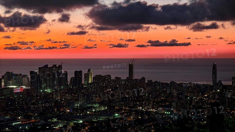 City view at night, illuminated, with red night sky and clouds, Batumi, Georgia