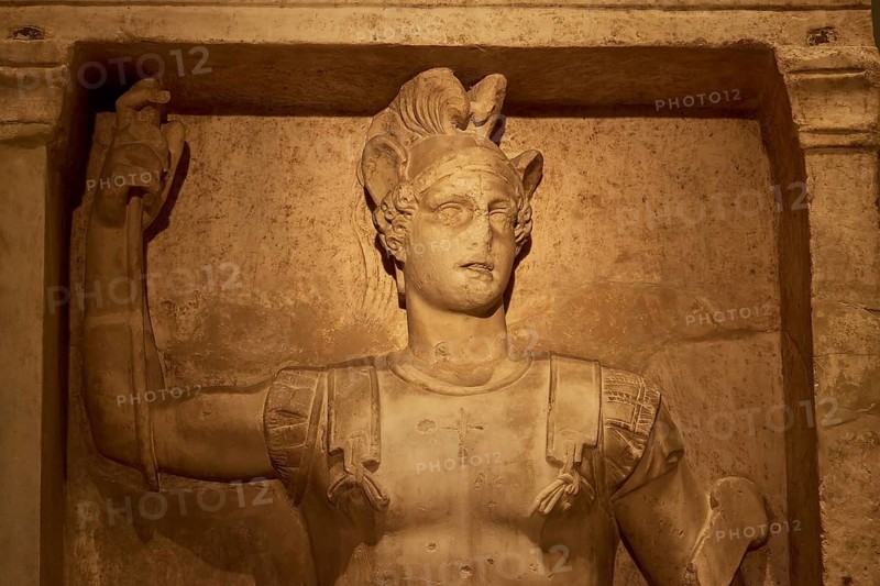 Relief of an ancient Roman warrior statue made of marble with raised arm, Patras Archaeological Museum, Patras, Peloponnese, Greece