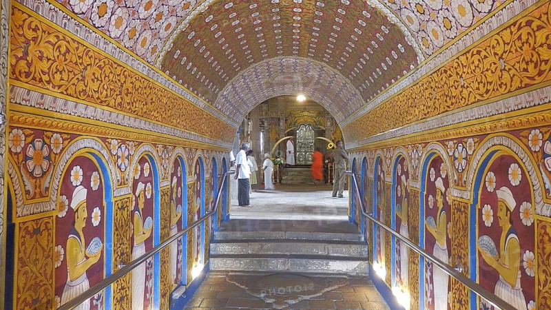 A richly decorated tunnel with painted walls in a temple, Temple of the Tooth, Kandy, Sri Lanka