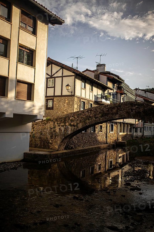 Charming stone bridge in Ea, Basque Country, Spain Traditional architecture reflected on serene waters, capturing the beauty and tranquility of this picturesque town