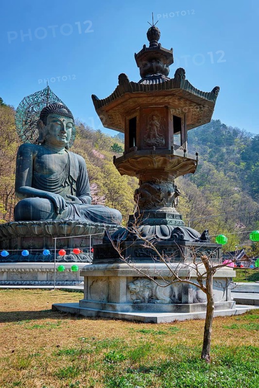 SEORAKSA, SOUTH KOREA, APRIL 15, 2017: The Great Unification Buddha Tongil Daebul is a 14. 6-meter 108 ton Bronze Buddha statue in Seoraksan National Park, South Korea