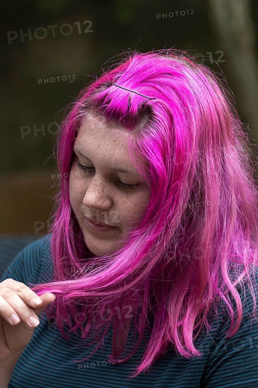 Portrait of a young woman with freckles and violet-colored hair, Ringsheim, Baden-Württemberg, Germany
