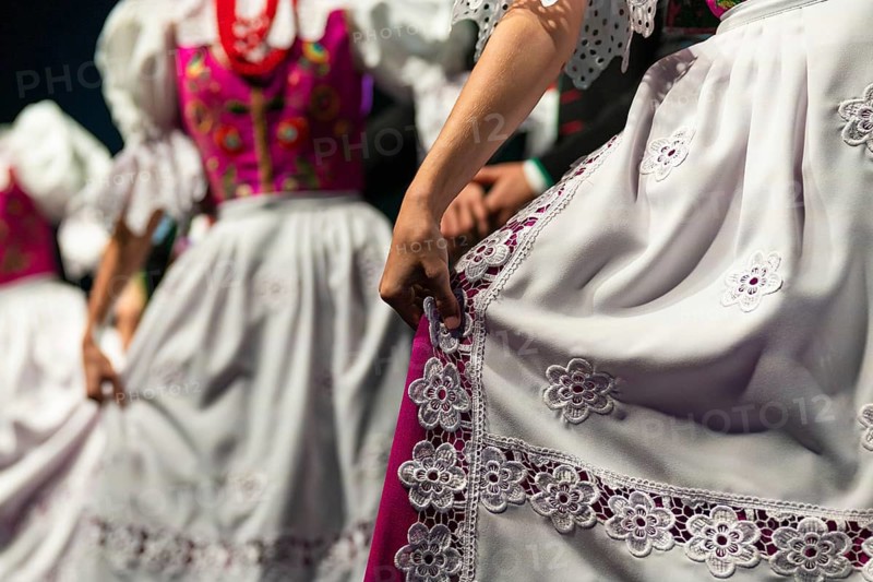 Detail of woman's hand with traditional dress during dance