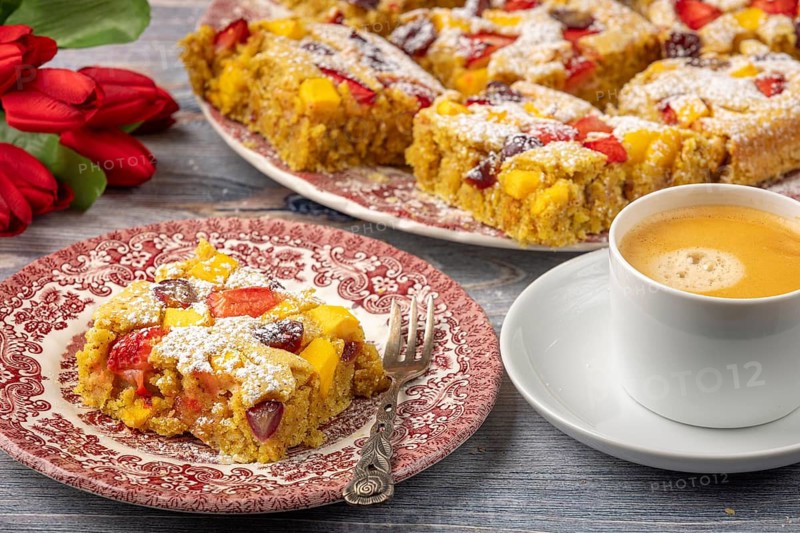 Plate of fruit cake served with coffee