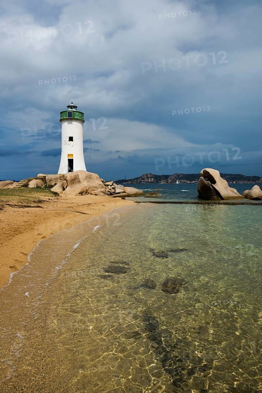 Lighthouse with beach and bizarre granite rocks, Spiaggia Porto Faro, Faro di Punta Palau, Palau, Costa Smeralda, Sardinia, Italy
