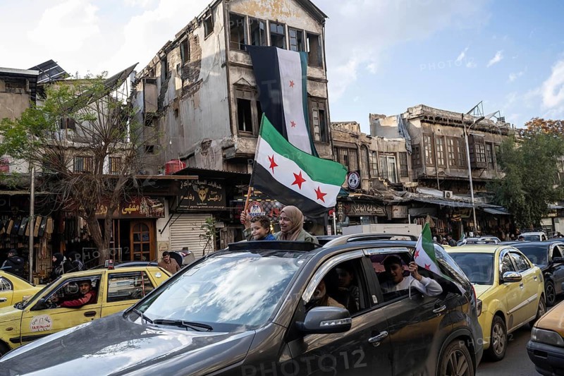 Damascus, Syria. December 7th 2025. Syrians waving flags and celebrating one year since the fall of the Assad regime, Damascus, Syria