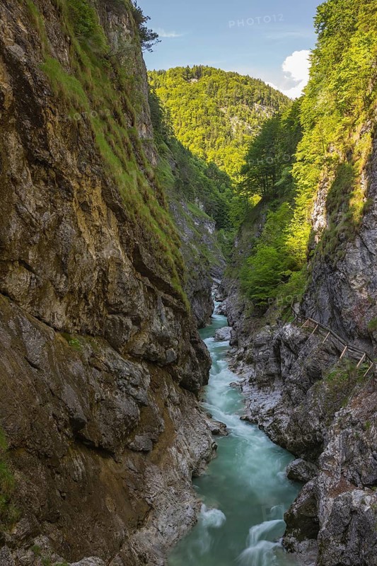 The Lammer creek is flowing fast through the Lammerklamm on a sunny hiking day