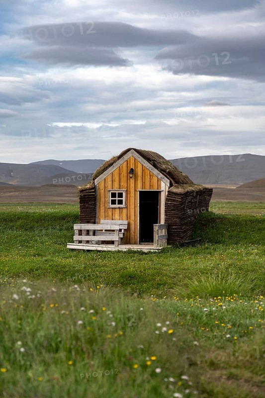 Small traditional wooden peat house with grass on the roof, Möðrudalur, Icelandic Highlands, Iceland