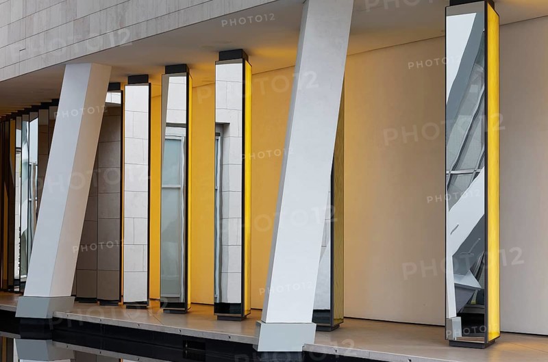 Fondation Louis Vuitton private museum, installation Inside he Horizon by Olafur Eliasson, yellow mirror columns, Bois de Boulogne, Paris, France