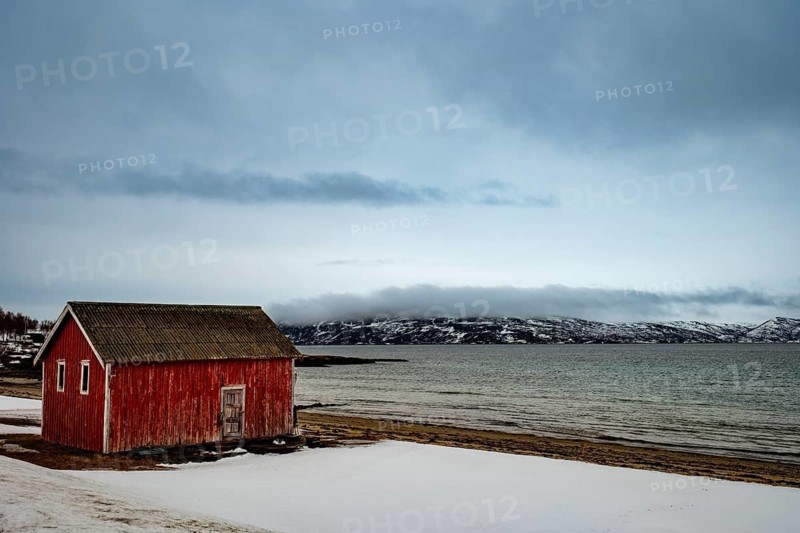 Red wooden cabin on the beach, Senja island, Troms, Norway