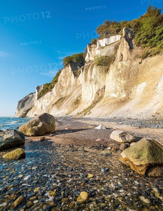 Beach with boulders at the chalk cliffs of Møns Klint on the Baltic Sea, Møn Island, Denmark