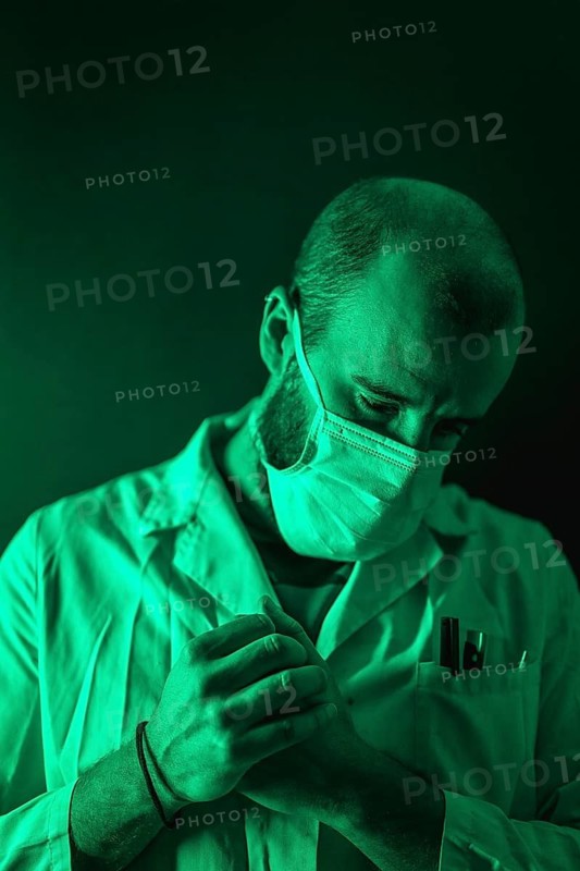A doctor working pensively on the coronavirus pandemic, Covid-19