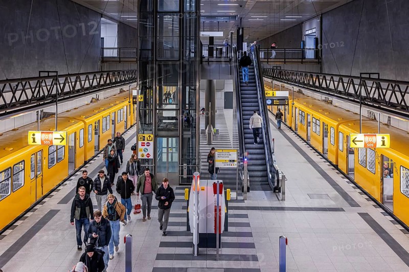 Central railway station subway station on line U5 with subway. People on the platform and on the stairs. Berlin, Germany
