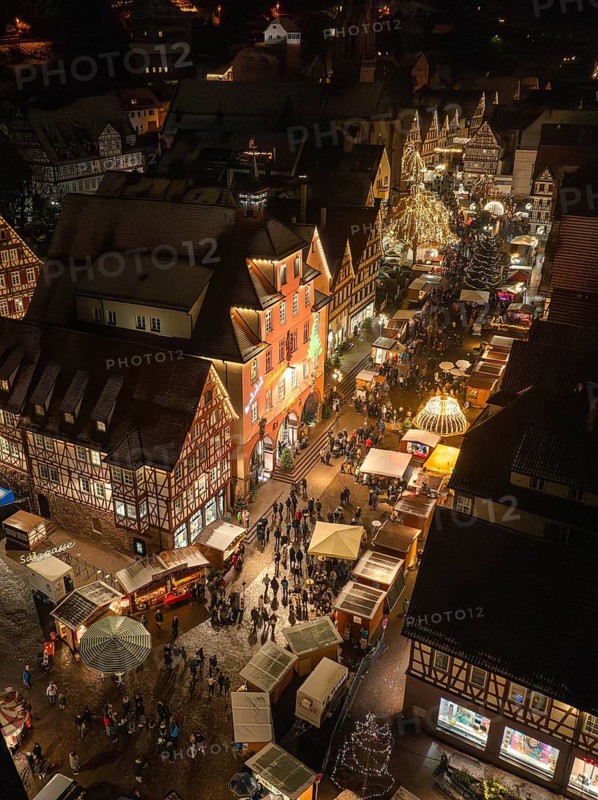 Aerial view of a lively Christmas market with many lights and visitors, Christmas market Calw, Black Forest, Germany
