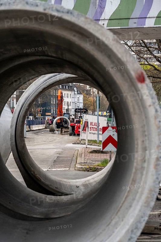 Concrete sewer pipes, stored on a construction site during sewer renovation work, on the Dickswall, city centre of Mülheim an der Ruhr, North Rhine-Westphalia, Germany