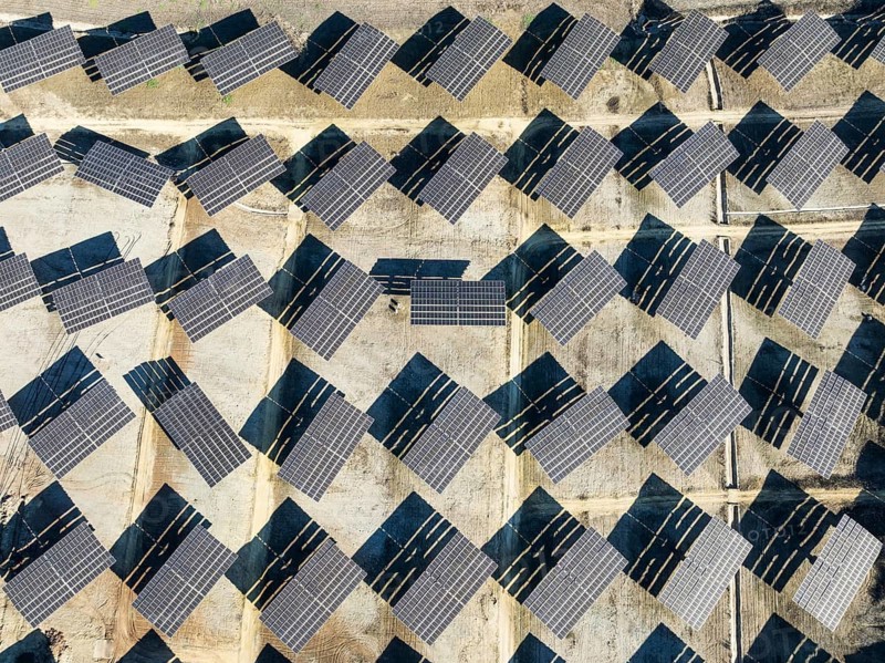 Rows of solar panels at a photovoltaic plant near Vejer de la Frontera. Aerial view. Drone shot. Cádiz province, Andalusia, Spain