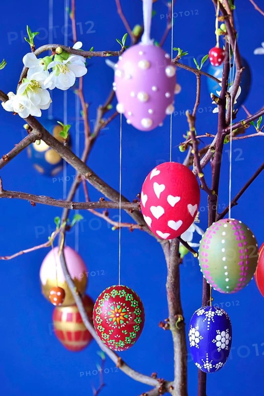 Easter, Easter bouquet with colorful Easter eggs, branches with flowers of an ornamental quince, spring, Germany