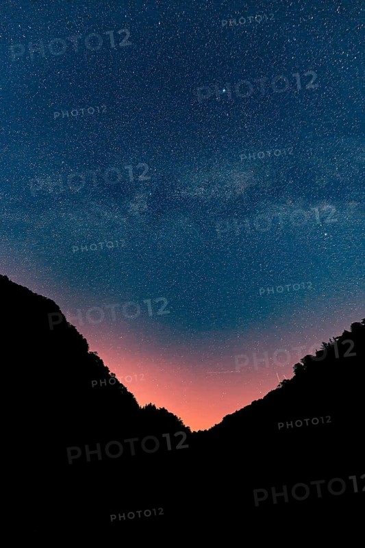 Milky Way in the night sky with mountains in the foreground, Ternitz, Lower Austria, Austria