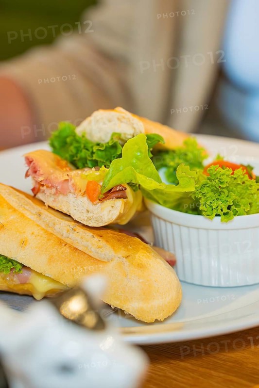 A fresh ciabatta sandwich with lettuce and tomato served on a plate, autumn creations, Cafe Kuh, Deckenpfronn, Black Forest, Germany
