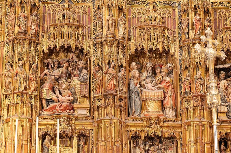 Close-up of ornate reliefs on a golden religious altar, Seville, Andalusia, Spain