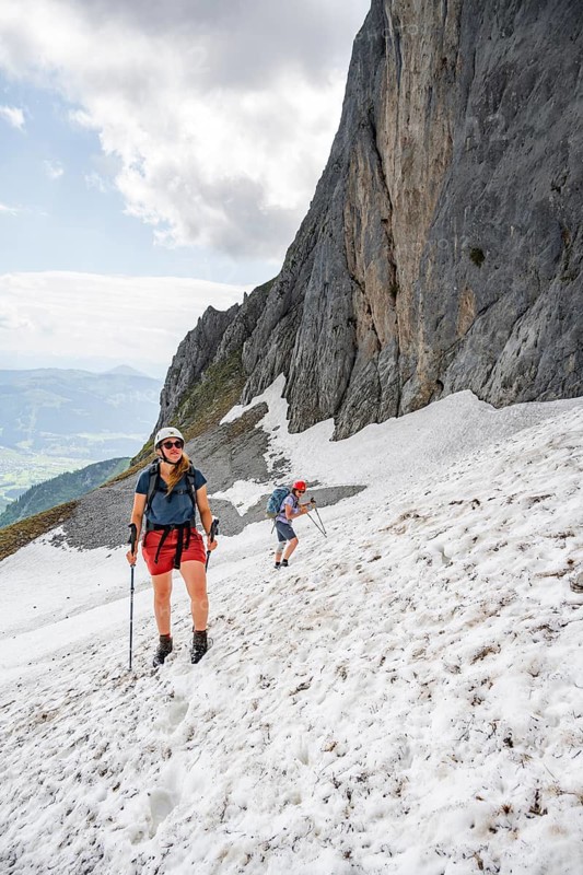 Mountaineer with helmet crossing a snowfield, ascent to the Ackerlspitze, Wilder Kaiser, Kaiser Mountains, Tyrol, Austria