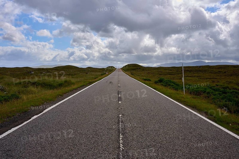 A long, lonely road stretches under a dynamic sky and stretches into the distance, Rannoch Moor, Bridge of Orchy, Scotland, United Kingdom, Great Britain
