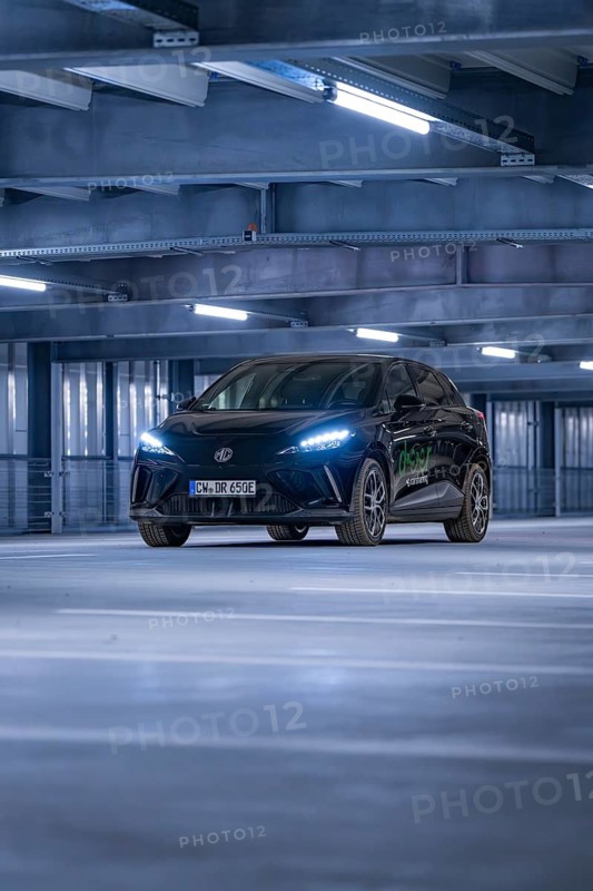 A car in a well-lit multi-storey car park with modern architecture, e-car sharing, Deer Mobility, MG4, Calw, Germany