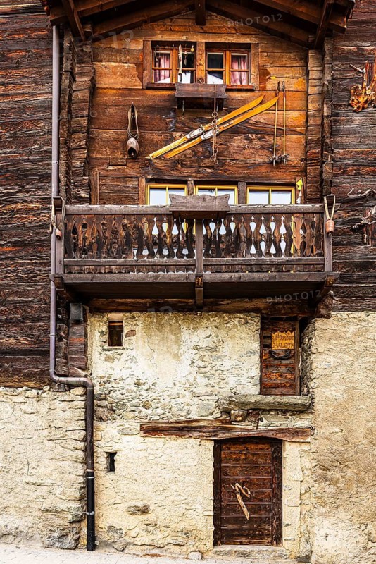 Old farmhouse with decorated wooden façade, historic town center, Grimentz, Val d'Anniviers, Valais Alps, Canton of Valais, Switzerland