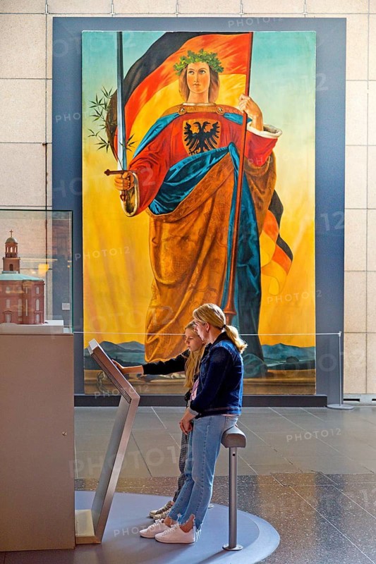 Two woman at a screen in front of the painting of Germania by Philipp Veit, Haus der Geschichte, Bonn, North Rhine-Westphalia, Germany