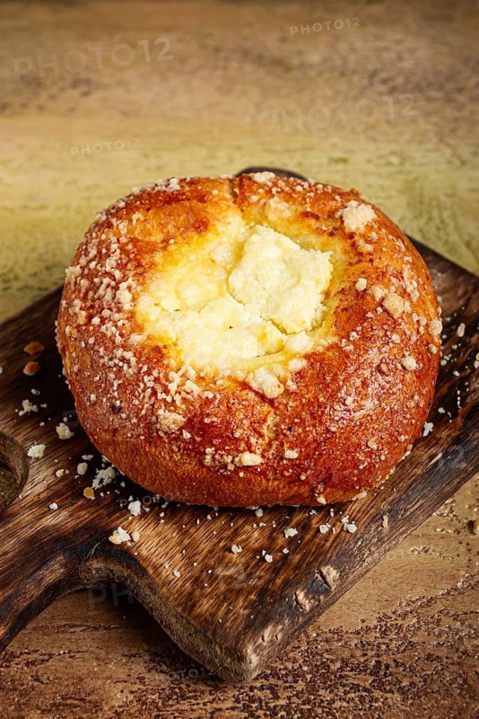 Bun with cottage cheese, pastries, cheesecake, no people