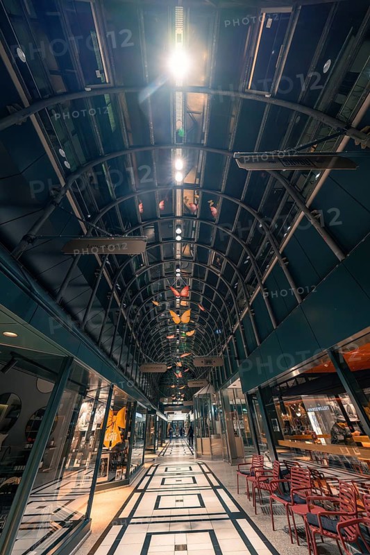 Interior view of a modern shopping centre with vaulted and illuminated ceiling, Calwer Tor, Stuttgart, Germany