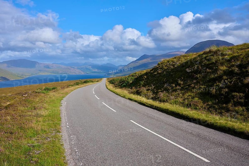 Course of a road through hilly landscape with mountains and blue sky, Little Loch Broom, view point, Durnamuck, Garve, Scotland, United Kingdom, Great Britain
