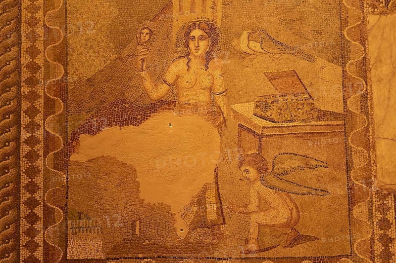Ancient mosaic depicting the goddess Aphrodite and a winged Cupid leaning over an opened box, Patras Archaeological Museum, Patras, Peloponnese, Greece