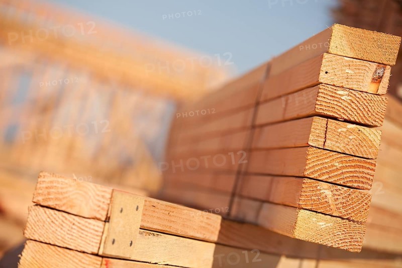 Stack of Building Lumber at Construction Site with Narrow Depth of Field