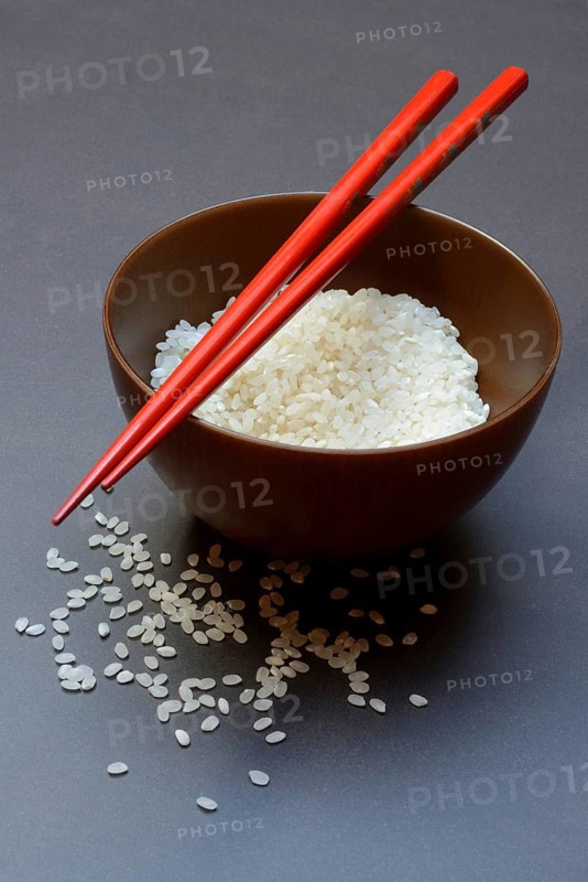 Rice, white rice in bowl with chopsticks, uncooked
