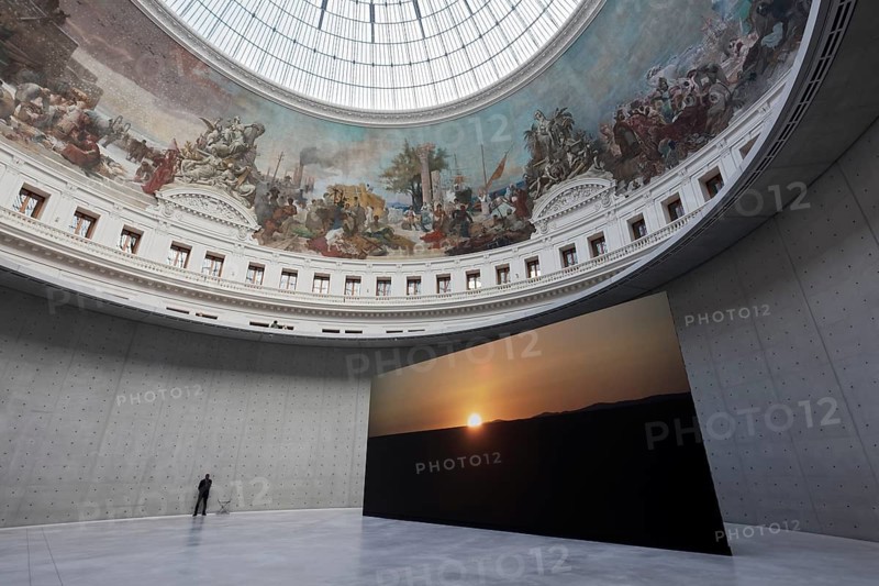 Bourse de Commerce, Pinault Collection, historic rotunda with concrete cylinder by architect Tadao Ando, large projection of the claire-obscure exhibition, Paris, France