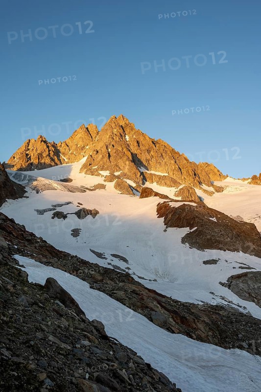 Rocky mountain peak, summit of the Aiguille de Tour in the evening light at sunset, Chamonix, Haute-Savoie, France
