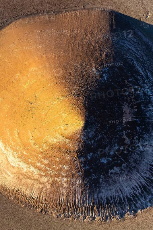 Top view, this stunning aerial photograph captures the mesmerizing Cono de Arita, a naturally occurring volcanic cone located in the Puna region of Salta, Argentina