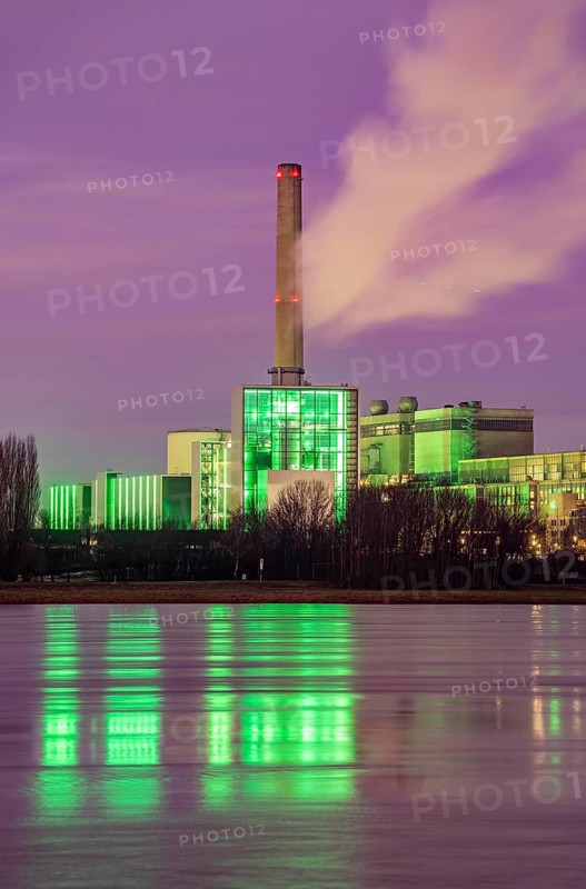 The Lausward combined heat and power plant in Düsseldorf, gas and steam turbine power plant, operated by Stadtwerke Düsseldorf and EnBW, on the Rhine, green illuminated city window, the chimney of the Fortuna power plant unit, the power plant generates electricity, also traction current and district heating, North Rhine-Westphalia, Germany