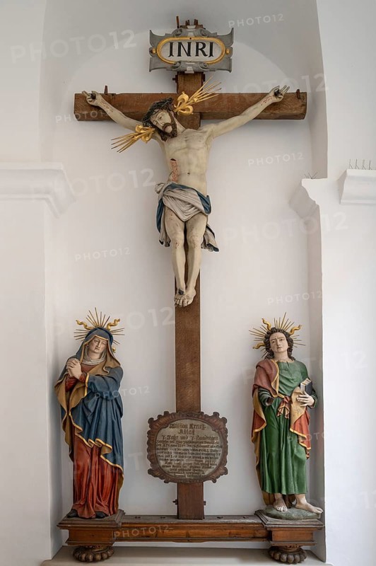 Christ's cross and female figures from 1754 in the Catholic parish church of St Emmeram, Wemding, Swabia, Bavaria, Germany