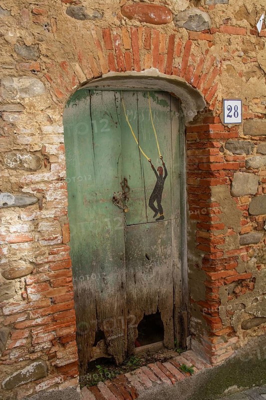 Door on an old house in Aliano, the very poor village in southern Italy that the writer Carlo Levi described in his book Christ stopped at Eboli. The book became a bestseller and was filmed. Aliano, Matera District, Basilicata, Italy, Southern Europe