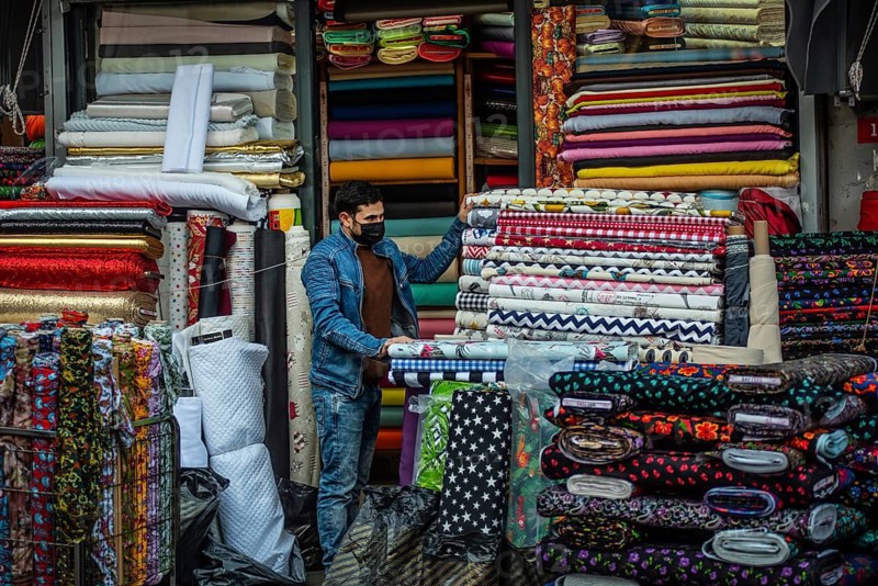 Istanbul, Turkey. November 28th 2020 A salesman wearing a protective face mask in the textile Bazaar of the Fatih District of Istanbul, Turkey