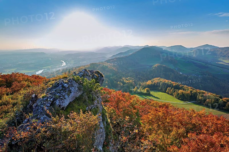 View of an autumnal forest from the Gisliflue, behind the Jura foothills with Wasserfluh and Strihen, Talheim, Canton, Aargau, Switzerland