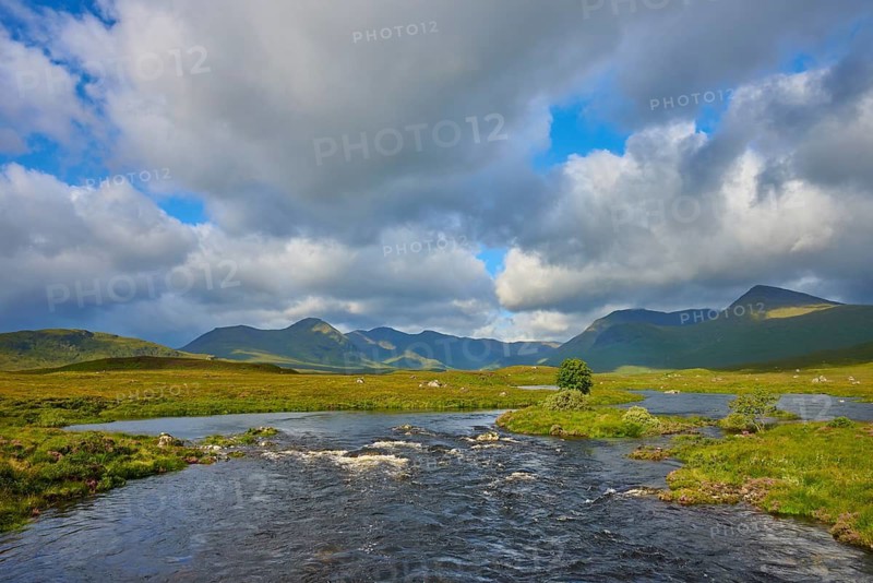 River in a vast landscape with mountains and clouds, sunny and peaceful, Rannoch Moor, Bridge of Orchy, Scotland, United Kingdom, Great Britain