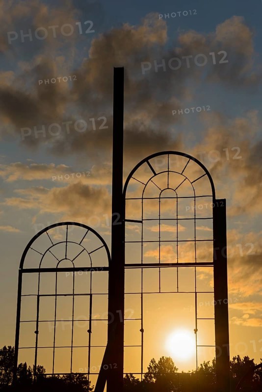 Two metallic window frames stand out against the dramatic sunset sky, Ilseder Hütte, Ilsede, Peine District, Lower Saxony, Germany