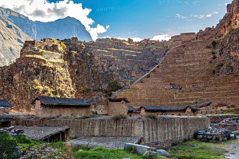 Ancient Inca ruins and structures with terraces against a mountain backdrop, The Inca ruins of Ollantaytambo in the Andes of Peru