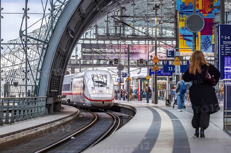Berlin Central Station. Travelers on the platform. Incoming train. ICE. Berlin, Germany