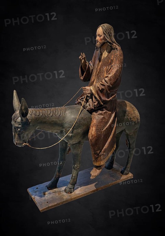 Palm tree donkey, wooden figure from around 1520, on a dark background, Diocesan Museum, Rottenburg, Baden-Württemberg, Germany